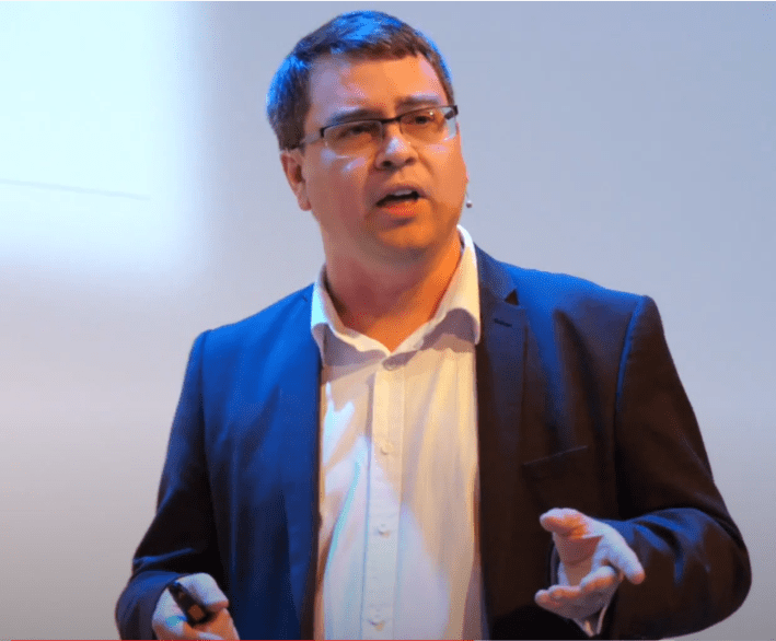 Mark speaking at an event